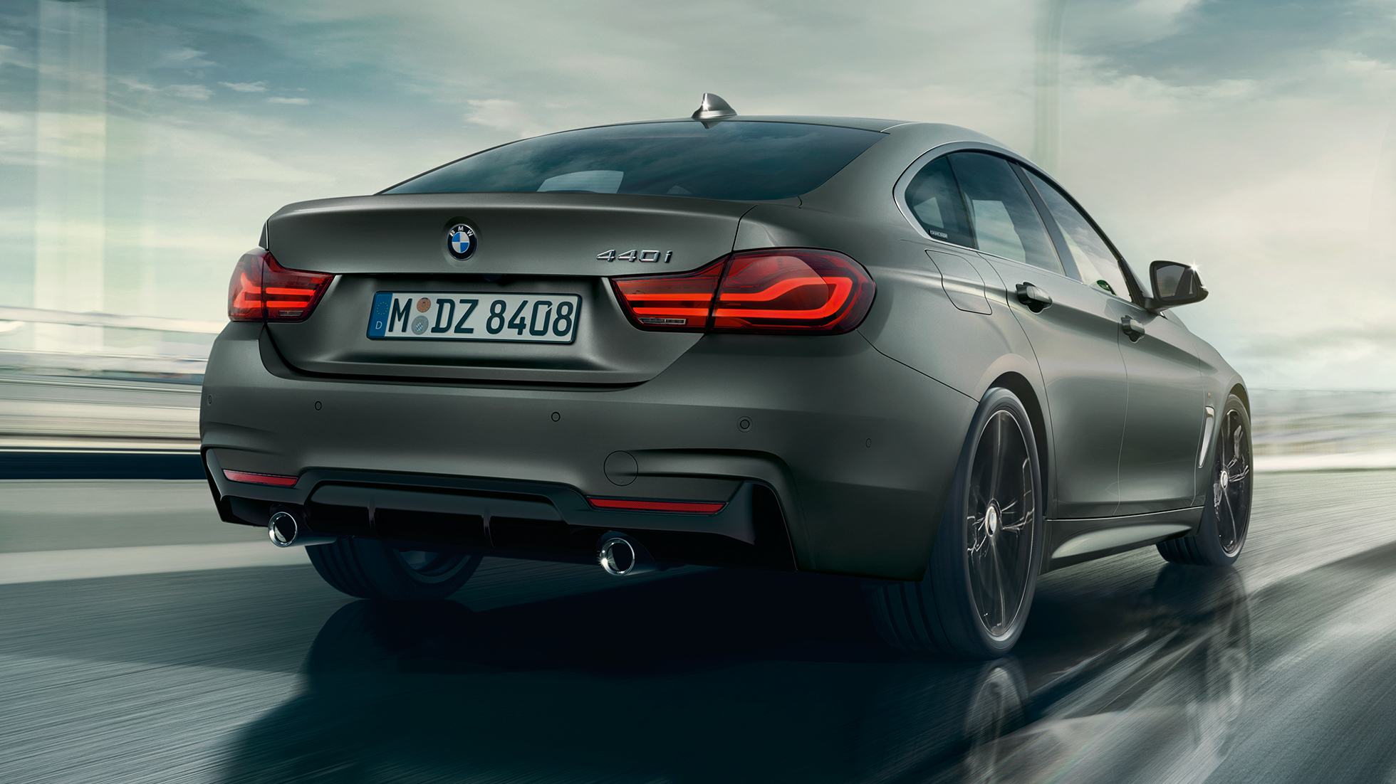 BMW 4 Series Gran Coupé, three-quarter rear shot while driving BMW 4 Series Gran Coupé, three-quarter rear shot while driving