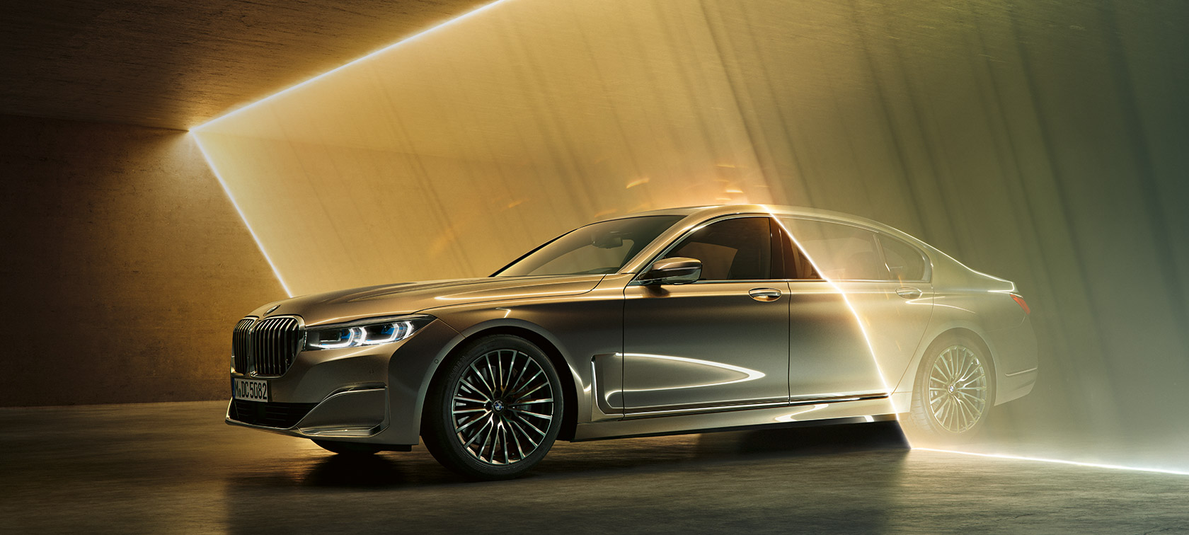 BMW 7 Series Sedan in three-quarter front view BMW 7 Series Sedan: grey BMW in three-quarter front view surrounded by beams of light