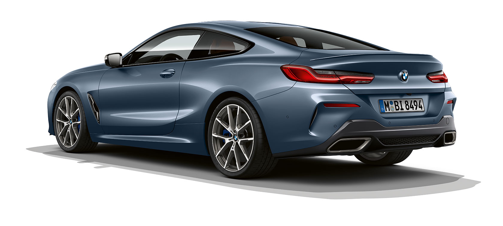 BMW 8-serie Coupé, Barcelona Blue metallic. BMW 8-serie Coupé, Barcelona Blue metallic, trefjärdedelsvy bakifrån.