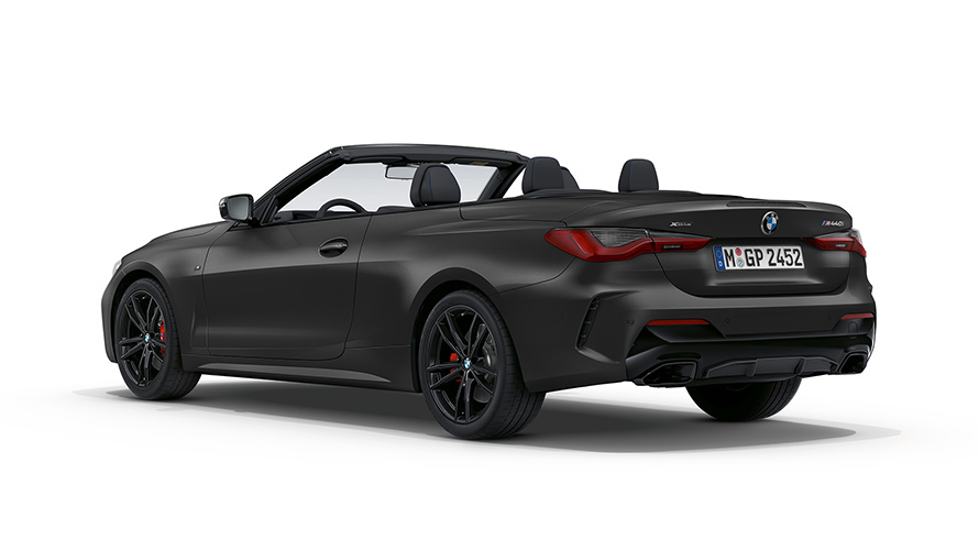 BMW M440i xDrive Cabriolet G23 2020 BMW Individual Frozen Deep Grey metallic sedd snett bakifrån med öppen tygsufflett